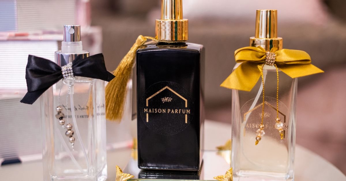 Elegant perfumes on a vanity decorated with ribbon
