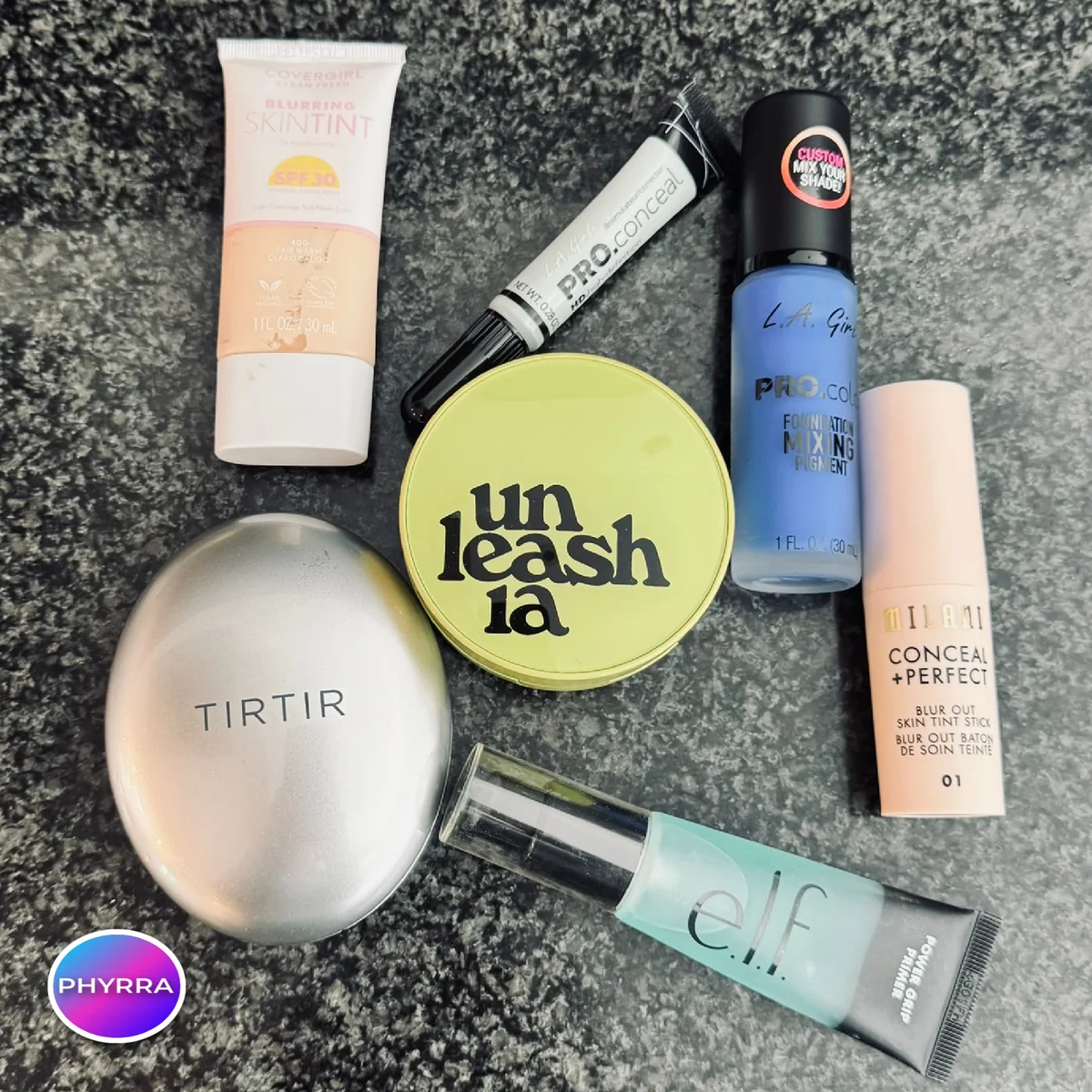 Flat lay of cruelty-free drugstore foundations under fifteen dollars