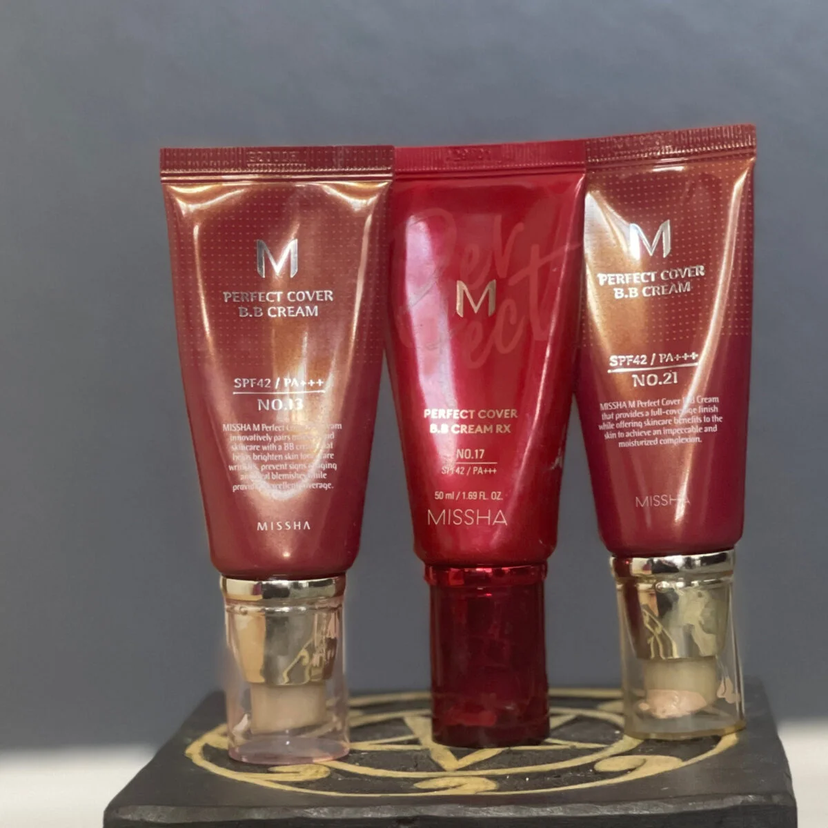Three Misha BB Cream shades swatched on skin arm