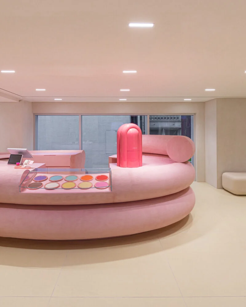 Pink curved customization counter with product displays